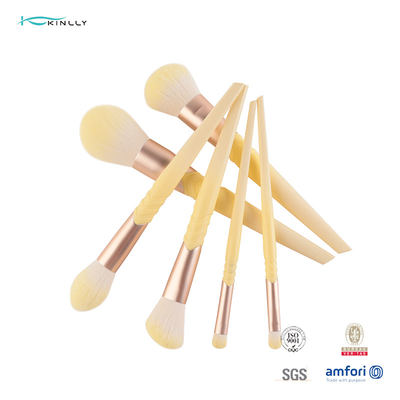 Le maquillage de luxe taillant d'olive balaye les cheveux synthétiques de la poignée 10pcs en plastique jaune